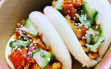 Two bao buns in a bowl from Tipsy Chef Street Food.