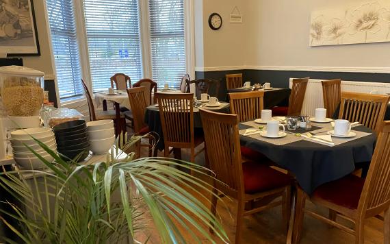 St Andrew's House Hotel dining room set up for breakfast.