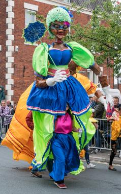 Large paper mache woman in 2017 carnival parade.