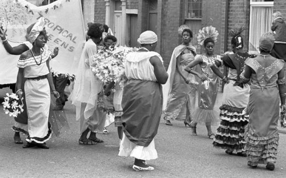 Women dancing on Preston streets during 1985 Caribbean Carnival parade. Photo credit: Lancashire Evening Post