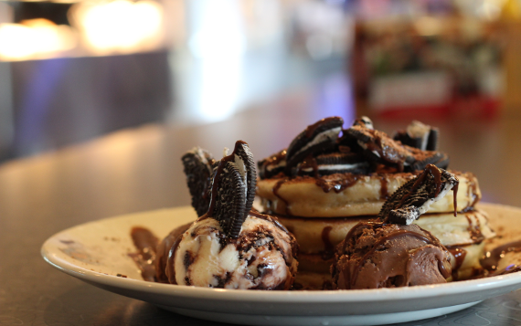 A plate of waffles, Oreo pieces, and chocolate ice cream from Billy Bob's Parlour