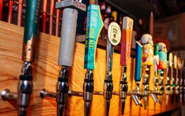 Beer taps behind the bar at Hopwoods Tap House