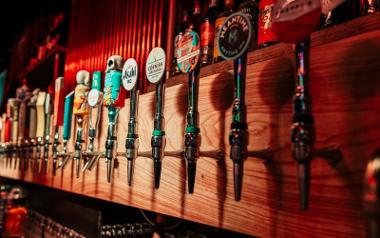 More beer taps behind the bar inside Hopwoods Tap House