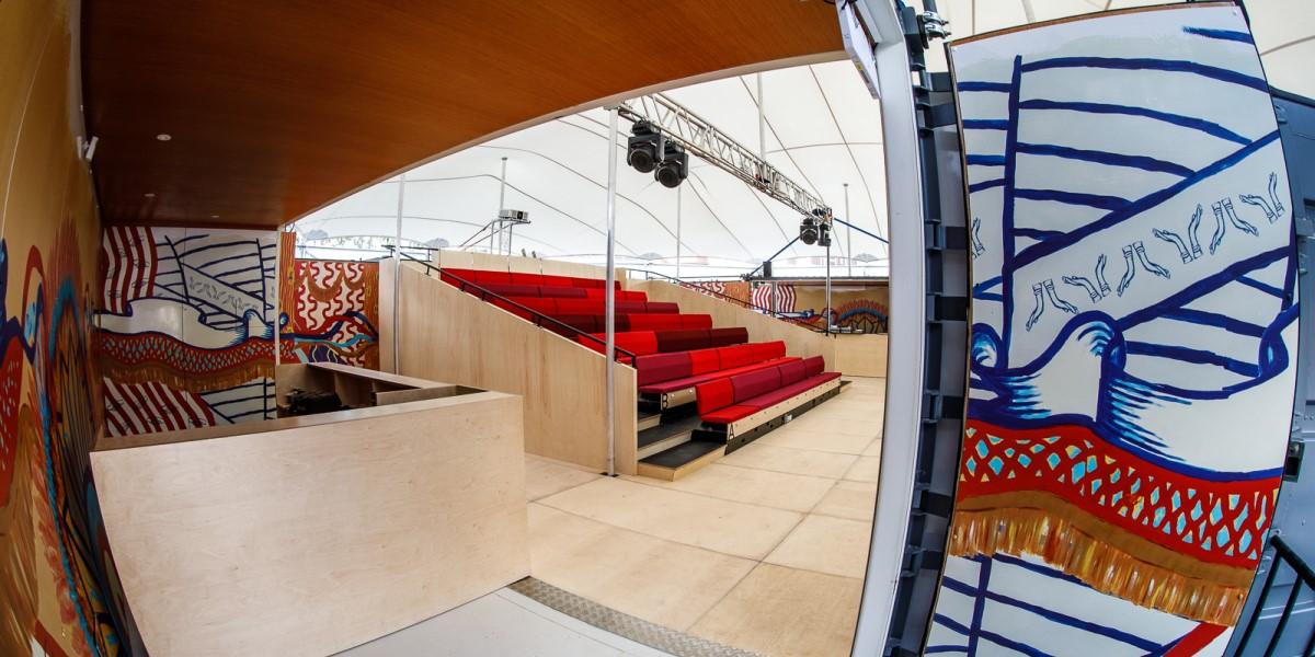 Looking inside the mobile event tent from the entrance way showing a seating area