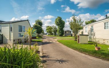 Rows of caravans on a sunny day at Bowland Lakes Leisure Village