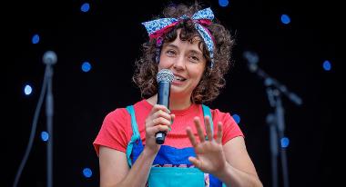 Performer on stage outside Guild Hall