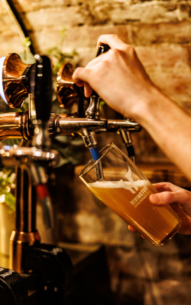 Bartender pulling a pint