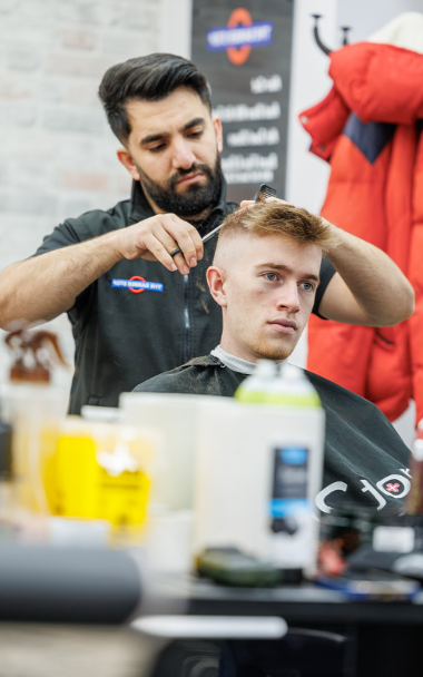 Barber cutting hair