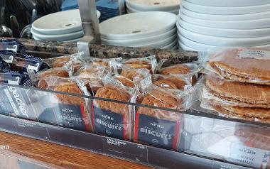 A close up of Caffé Nero biscuits and caramel waffles at the counter in Caffé Nero Friargate