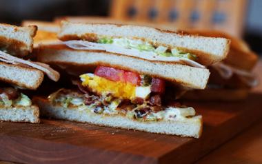 A close up of a bacon, lettuce and tomato sandwich from Raffles Coffee House