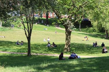 People relaxing on Winckley Square Gardens