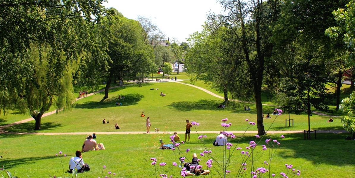 People relaxing at Winckley Square Gardens