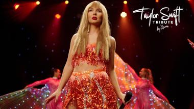 Xenna from the Taylor Swift Tribute performing on stage in a shiny red outfit