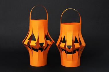 Two orange spooky paper lanterns