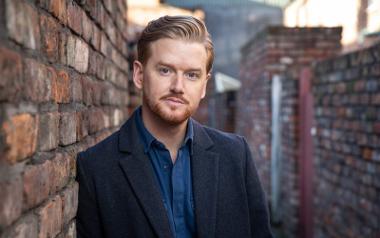 A portrait photo of the actor Mikey North