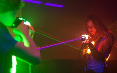 Young people playing laser quest