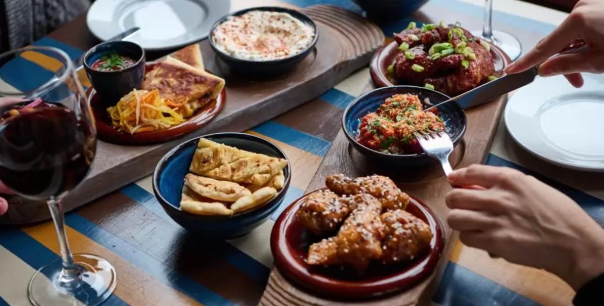 Close up of people eating tapas