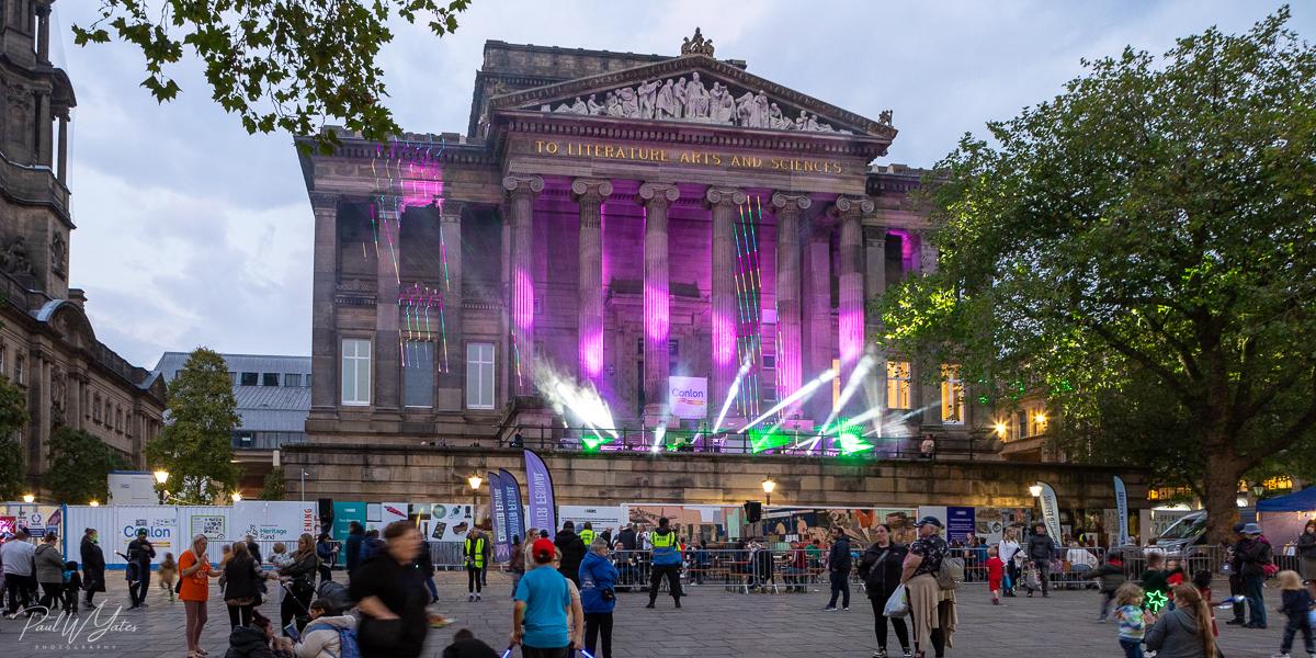 The Harris building lit up with colourful lights during Encounter Festival