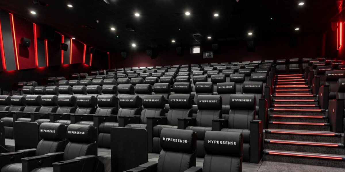 Rows of seats inside a screen room of Arc Cinema