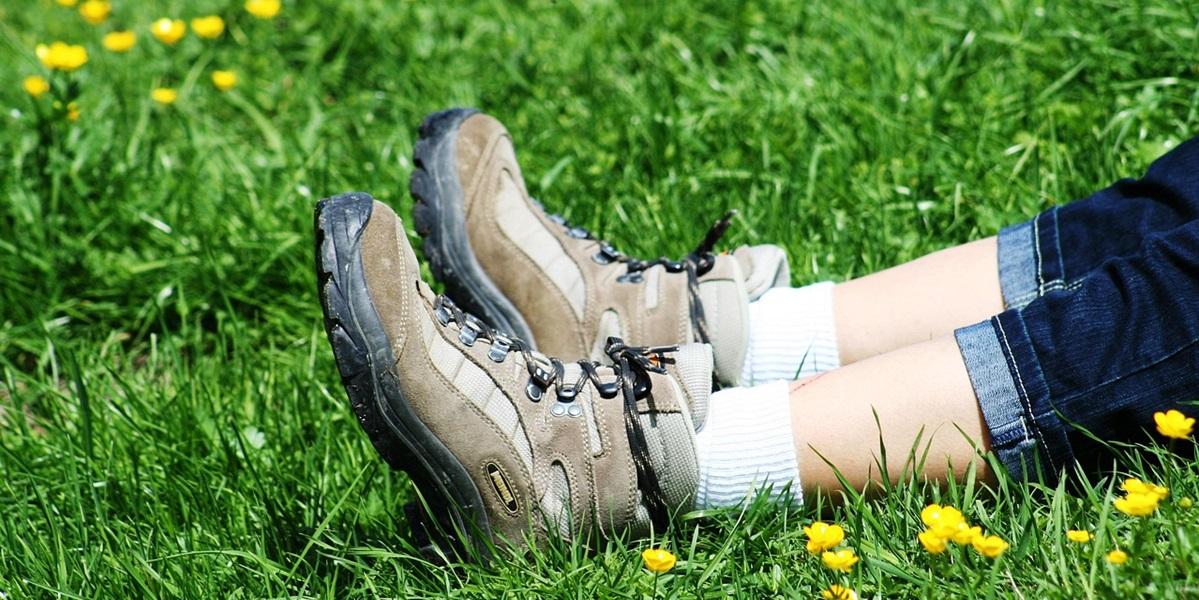 Walking boots in meadow close up