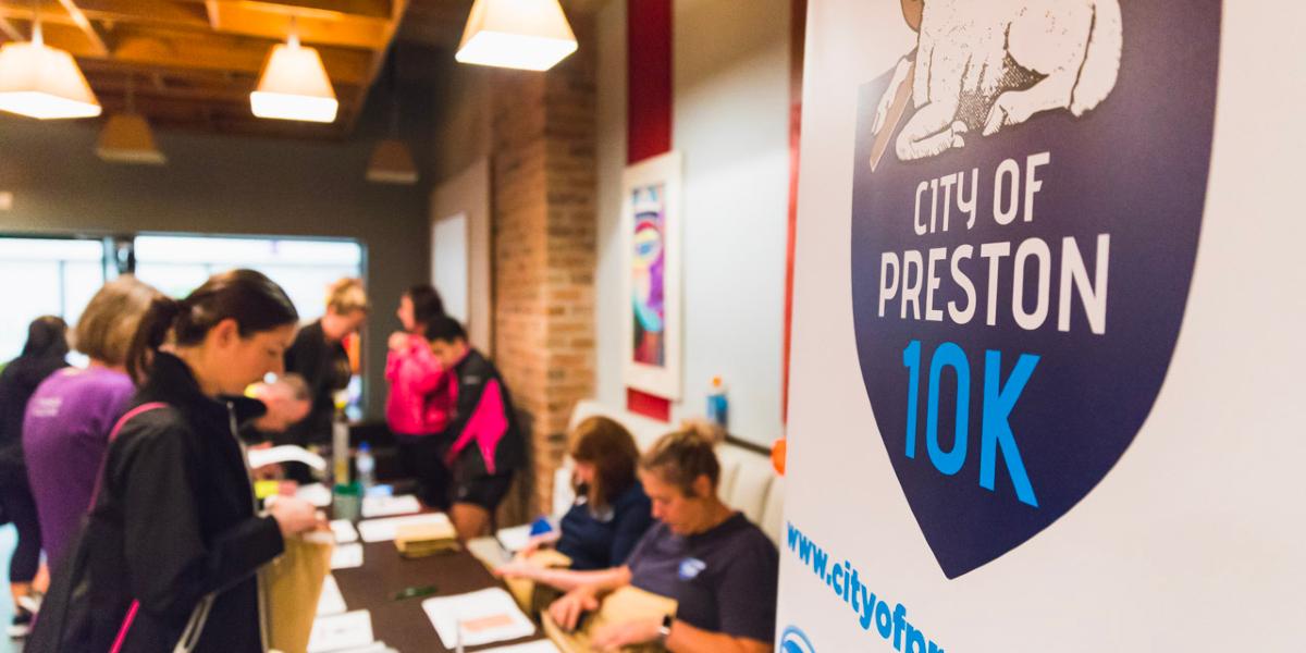 Main image: Runners signing up for the City of Preston 10K event. Runners signing up for the City of Preston 10K event.