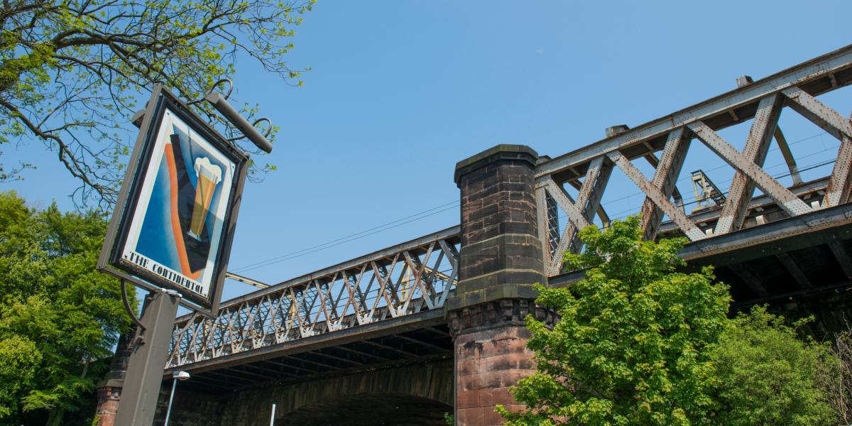 Main image: The Continental pub's sign with bridge and Miller Park in the background. The Continental pub's sign with bridge and Miller Park in the background.