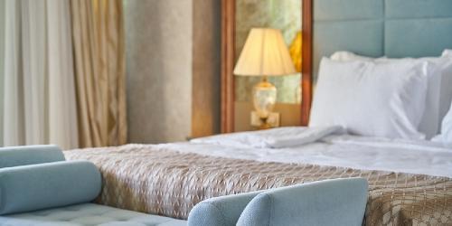 Page Icon: Double bed in hotel room. Double bed in hotel room.