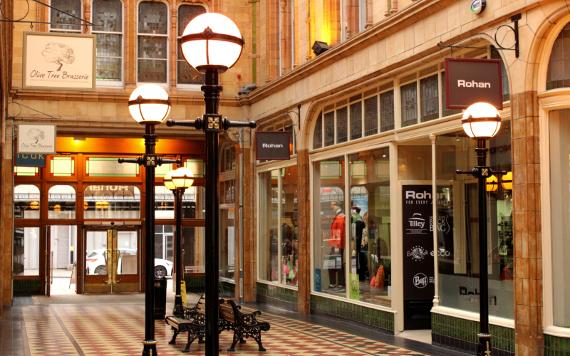 Vintage lampposts and shops inside Miller Arcade, Preston.