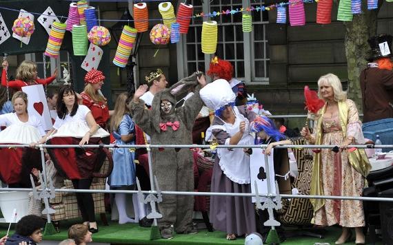 2012 Preston Guild trades procession float with Alice in Wonderland scene.