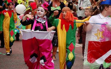 Children in clown outfits during a Preston Guild procession.