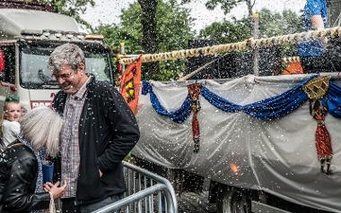 Bystanders being sprayed with foam at Preston Caribbean Carnival.