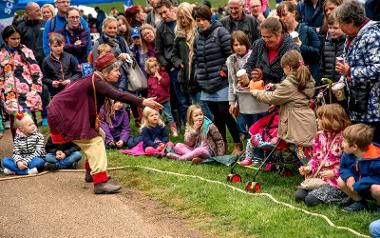 Woman performing in front of crowd at Egg Rolling event. Photo credit: Michael Porter.