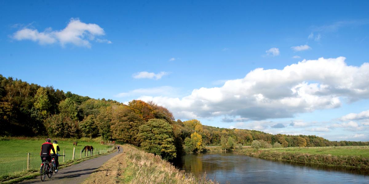 Main image: Cyclists along Guild Wheel pathway. Cyclists along Preston Guild Wheel next to the River Ribble.