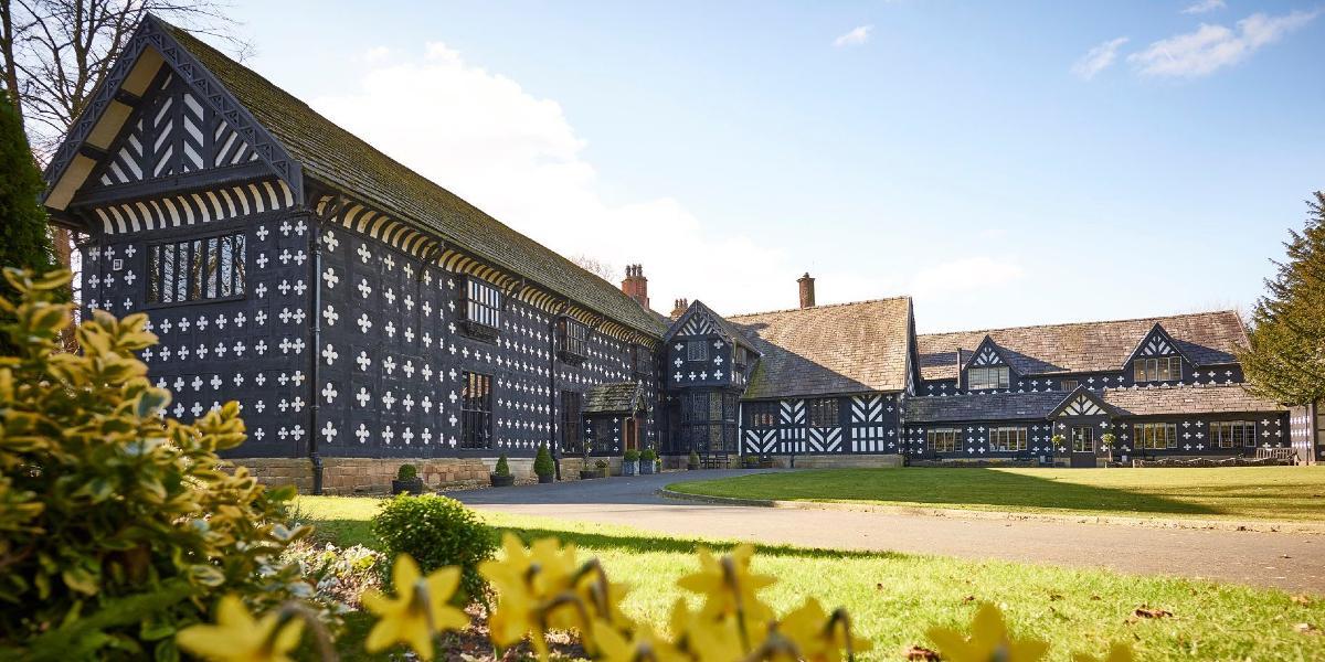 Main image: Samlesbury Hall exterior. Samlesbury Hall exterior with daffodils in the foreground.