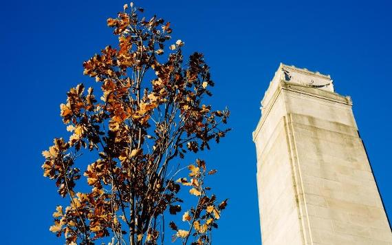 Tip of Preston Cenotaph against blue sky.