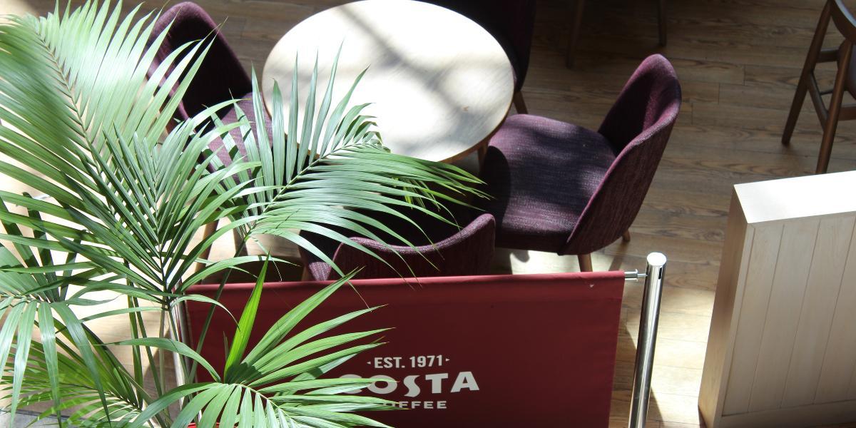 Main image: Costa sign and seating in St George's Shopping Centre. Costa sign and seating in St George's Shopping Centre.