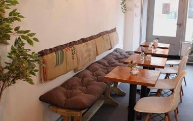 Bench seating inside Origin Juice and Brew Bar.