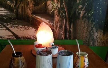 Himalayan salt lamp on table with Yerba Mate tea inside Tea House, Preston.