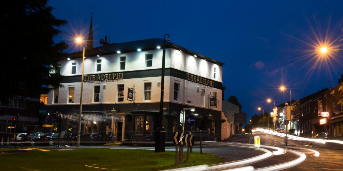 Main image: Outside the Adelphi at night with time-lapse of traffic passing by. Outside the Adelphi at night with time-lapse of traffic passing by.