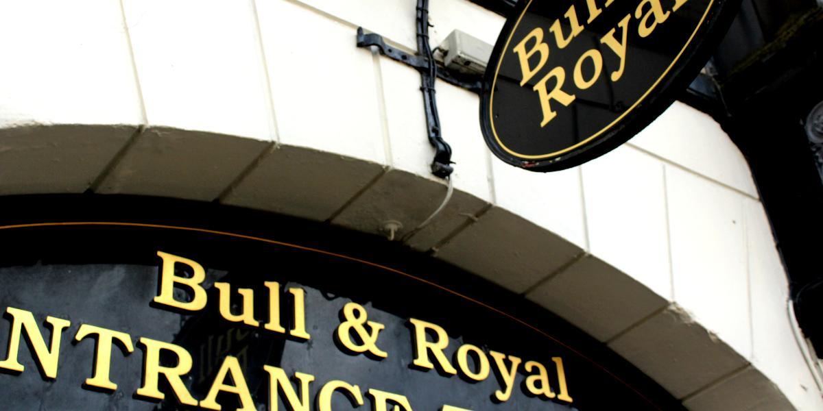 Main image: Close-up of The Bull and Royal sign above archway entrance. Close-up of The Bull and Royal sign above archway entrance.