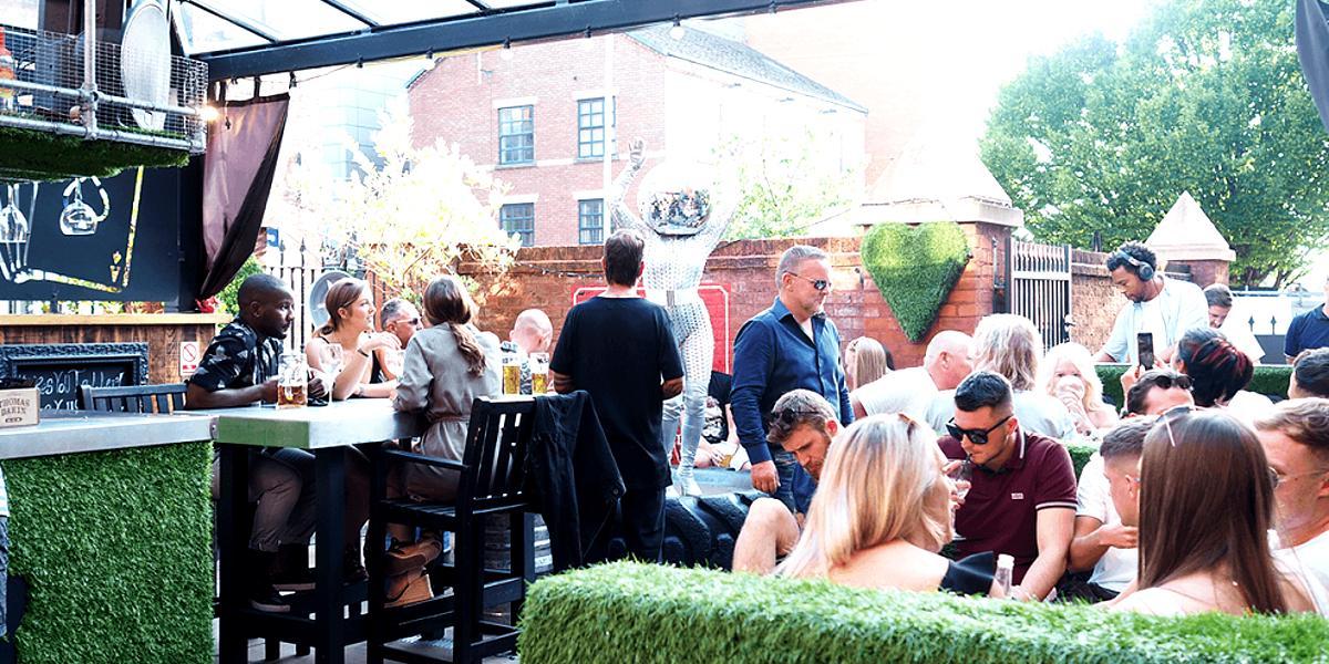 Main image: Groups drinking and enjoying sun outside in 1842's Rabbit Hole. Groups drinking and enjoying sun outside in 1842's Rabbit Hole.