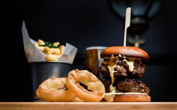 Burger, chips, and onion rings from The Wellington Inn.