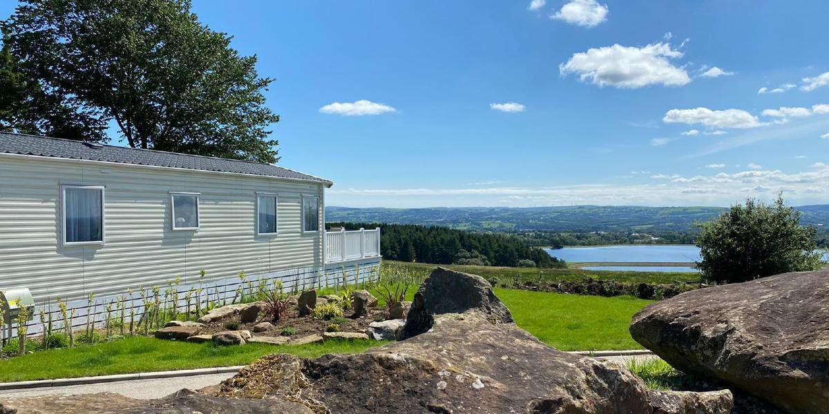 Caravan looking over countryside views from Beacon Fell View Holiday Park. Caravan looking over countryside views from Beacon Fell View Holiday Park.
