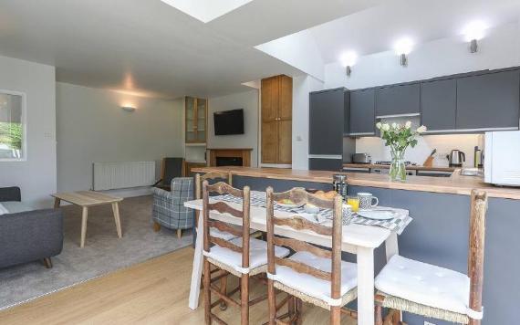 Open plan kitchen, dining, and living area in Bedzzz self-catering accommodation.