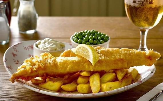 Fish and chips dish and beer served at the Bluebird Inn.