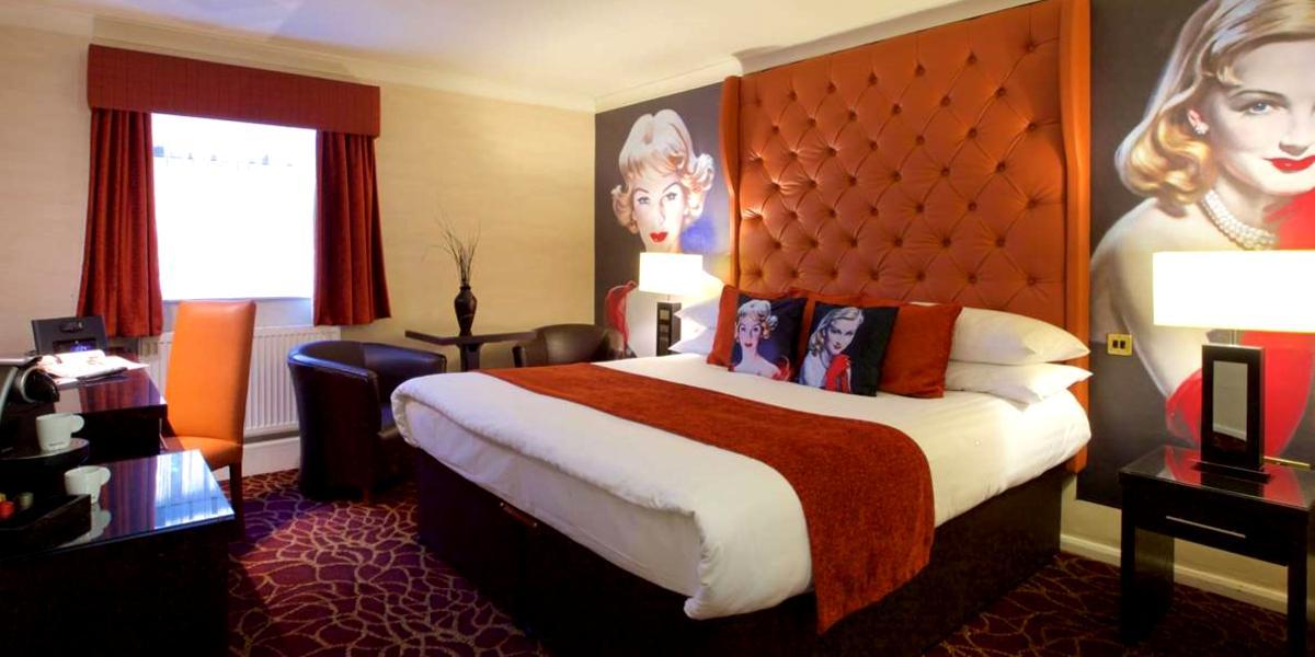 Main image: Hotel room with retro paintings inside Preston Leyland Hotel. Hotel room with retro paintings inside Preston Leyland Hotel.