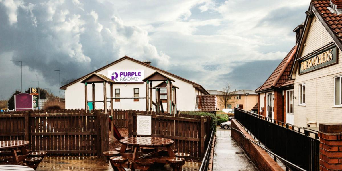 Main image: Outside Purple Roomz hotel, with children's play area and next door pub. Outside Purple Roomz hotel, with children's play area and next door pub.