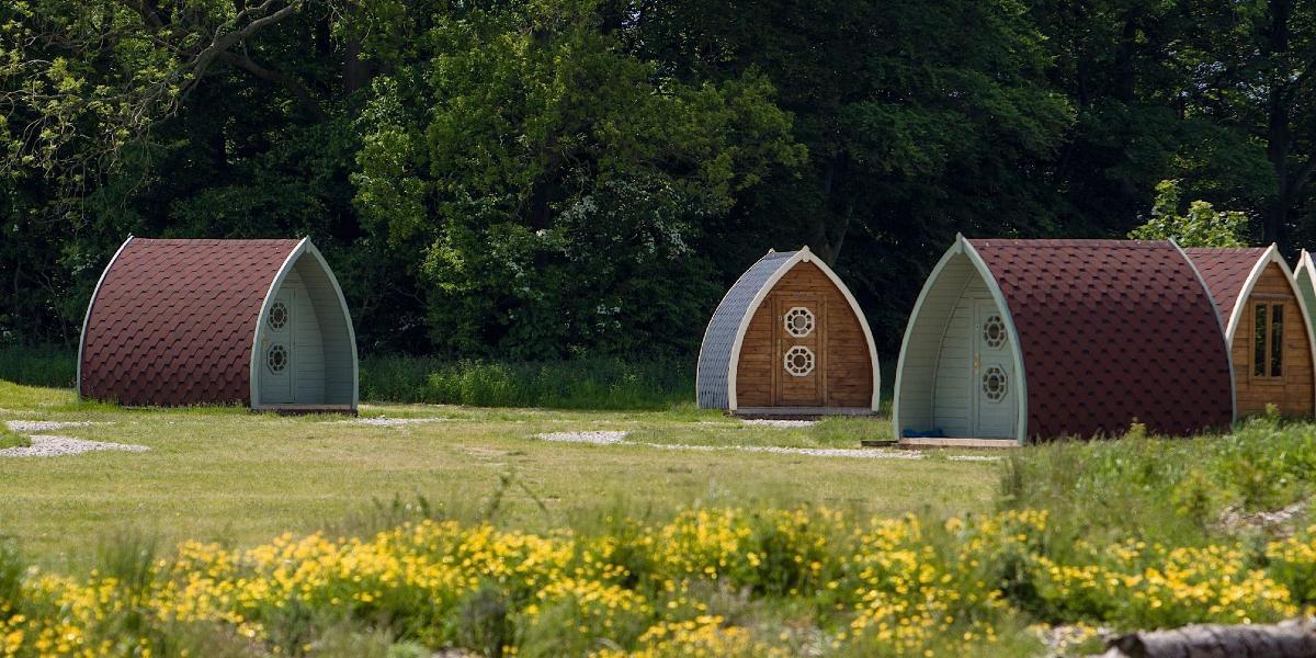 Array of different coloured camping pods at Stanley Villa Farm.