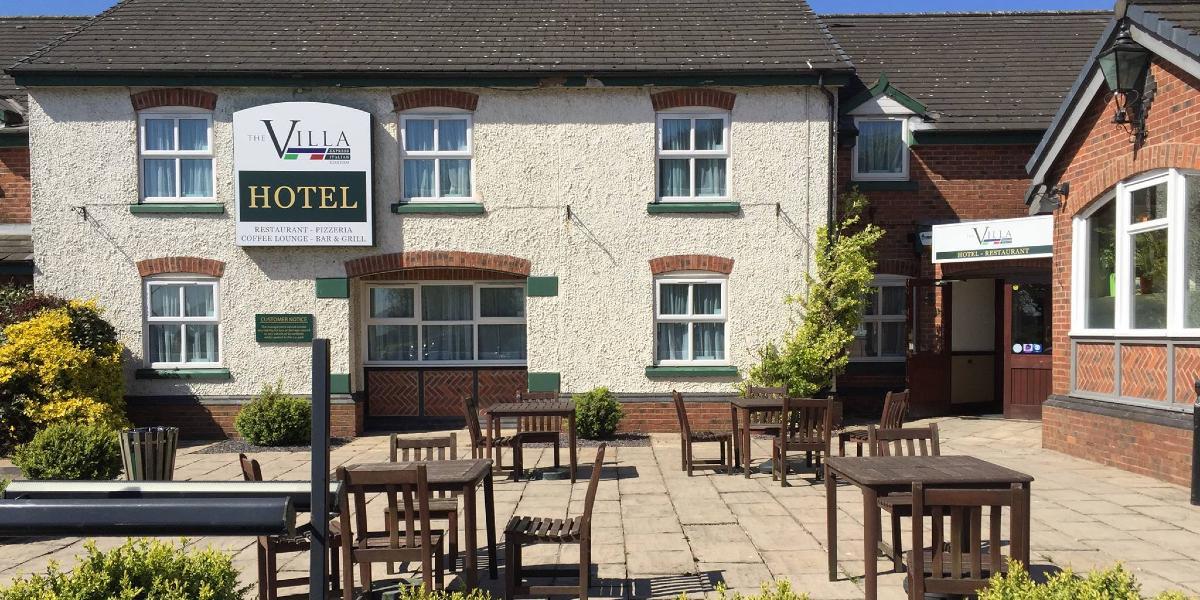Main image: Outside the Villa Express hotel and outdoor seating. Outside the Villa Express hotel and outdoor seating.