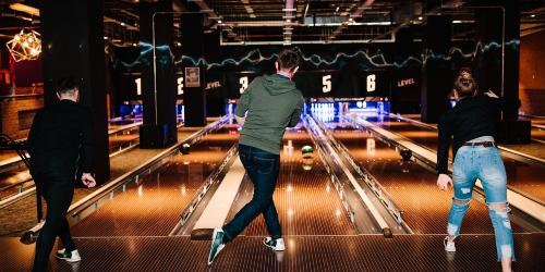 Page icon: Three friends playing bowling in Level Preston. Three friends playing bowling in Level Preston.